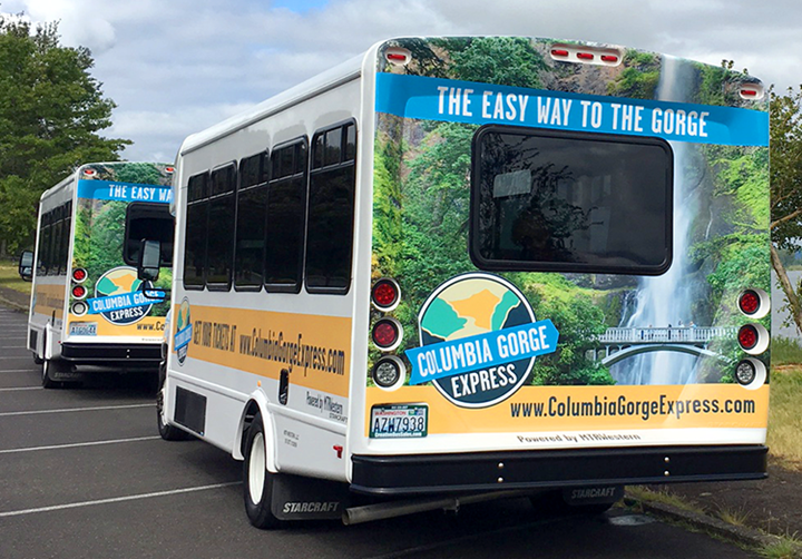 Columbia Gorge Express bus with branding graphics
